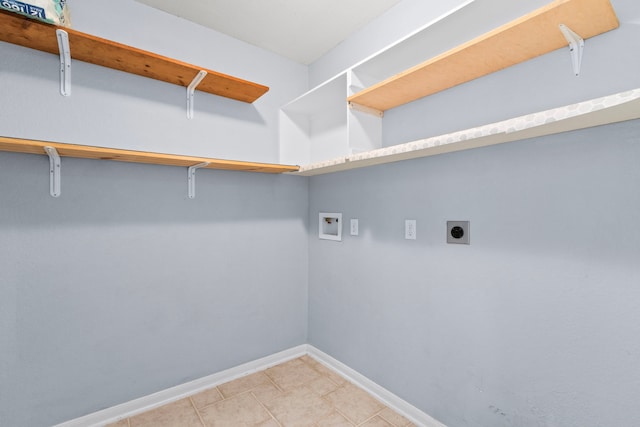 3815 Griffin Ln, Missouri City, TX 77459 - laundry room with electric dryer hookup, hookup for a washing machine, and baseboards