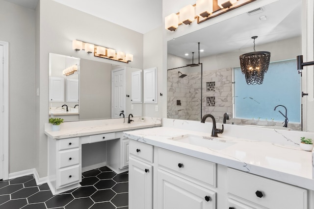 3815 Griffin Ln, Missouri City, TX 77459 - bathroom featuring a chandelier, vanity, tiled shower, and tile patterned floors