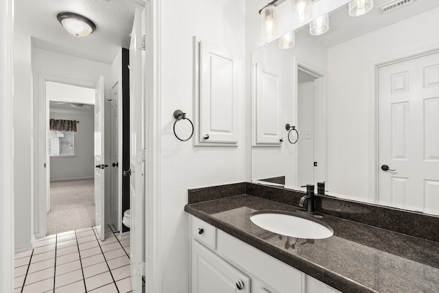 3815 Griffin Ln, Missouri City, TX 77459 - bathroom with vanity, toilet, and tile patterned floors