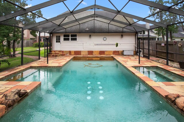3815 Griffin Ln, Missouri City, TX 77459 - view of pool with a patio, glass enclosure, and a pool with connected hot tub