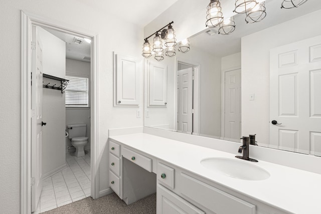 3815 Griffin Ln, Missouri City, TX 77459 - bathroom with a chandelier, vanity, toilet, and tile patterned flooring