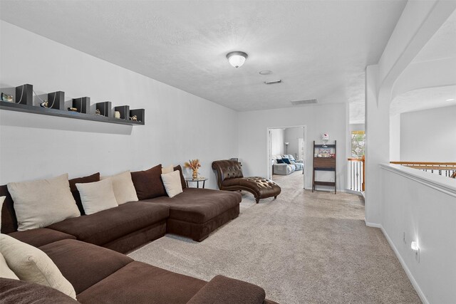 1012 Walnut Pointe, League City, TX 77573 - carpeted living room featuring baseboards