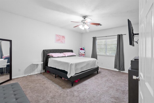 1012 Walnut Pointe, League City, TX 77573 - bedroom featuring carpet, baseboards, and a ceiling fan