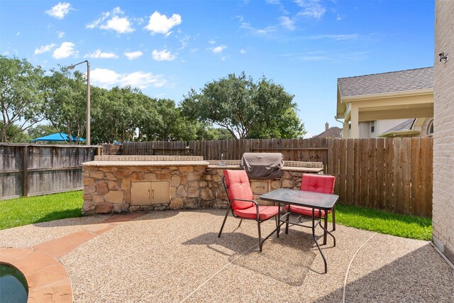 1012 Walnut Pointe, League City, TX 77573 - fenced backyard with a patio and outdoor dining area