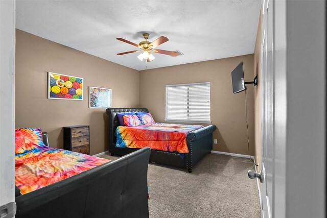 1012 Walnut Pointe, League City, TX 77573 - bedroom with carpet floors, baseboards, and ceiling fan