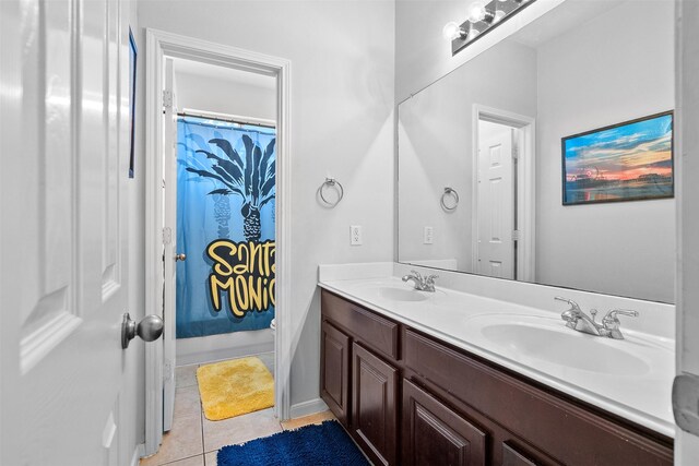 1012 Walnut Pointe, League City, TX 77573 - bathroom featuring double vanity, tile patterned floors, and curtained shower