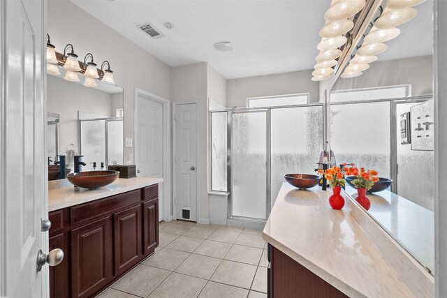 1012 Walnut Pointe, League City, TX 77573 - bathroom featuring vanity, tile patterned floors, a shower stall, and a chandelier