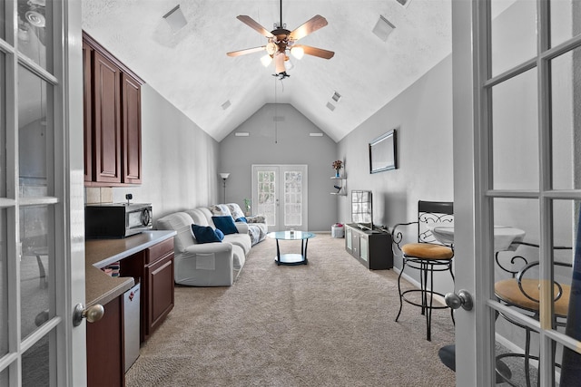 1012 Walnut Pointe, League City, TX 77573 - living area featuring ceiling fan, light colored carpet, and vaulted ceiling