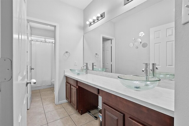 1012 Walnut Pointe, League City, TX 77573 - full bath featuring double vanity, toilet, tile patterned flooring, and a shower with curtain