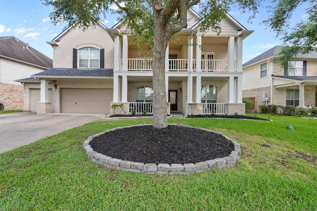 1012 Walnut Pointe, League City, TX 77573 - greek revival inspired property with brick siding, a balcony, covered porch, and driveway