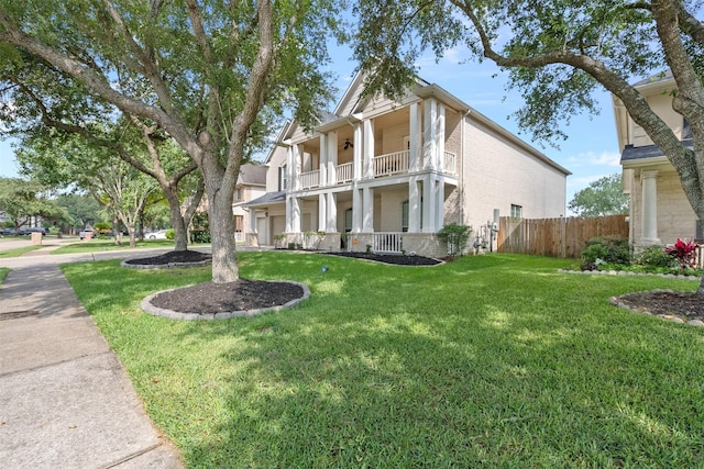 1012 Walnut Pointe, League City, TX 77573 - view of front of house featuring a balcony, brick siding, and a porch