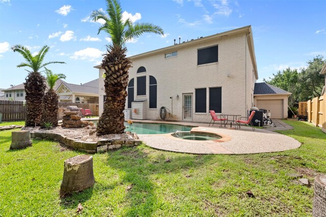 1012 Walnut Pointe, League City, TX 77573 - rear view of house with brick siding, an in-ground hot tub, and a patio