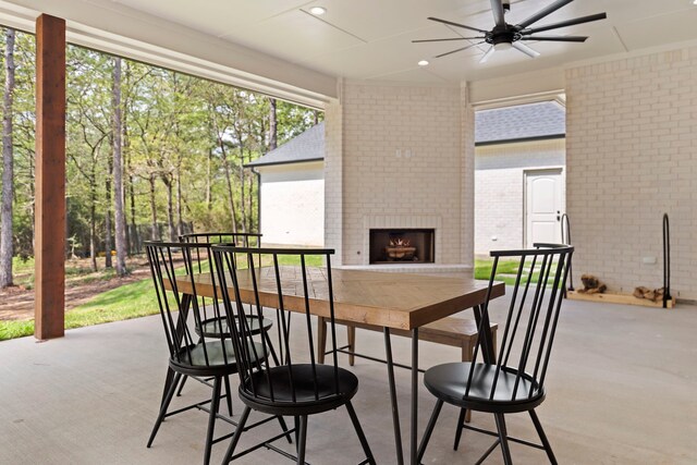 567 Lonestar Rd, Huntsville, TX 77340 - view of patio / terrace featuring an outdoor brick fireplace and ceiling fan