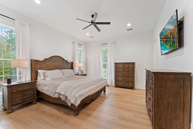 567 Lonestar Rd, Huntsville, TX 77340 - bedroom with multiple windows, light wood-style floors, recessed lighting, and ceiling fan