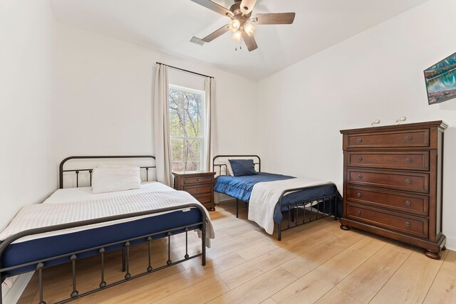 567 Lonestar Rd, Huntsville, TX 77340 - bedroom with light wood-type flooring and ceiling fan