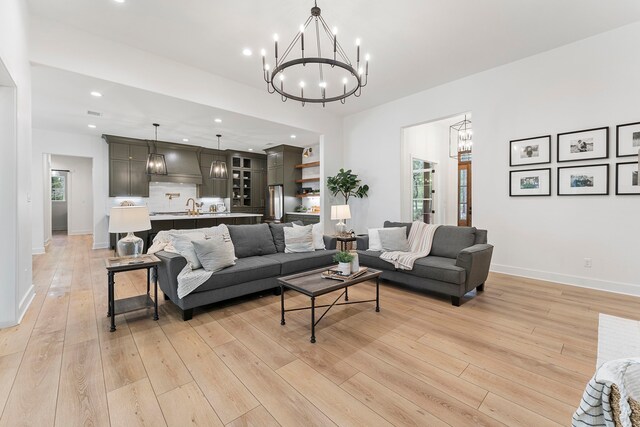 567 Lonestar Rd, Huntsville, TX 77340 - living area with a chandelier, light wood-type flooring, recessed lighting, and baseboards