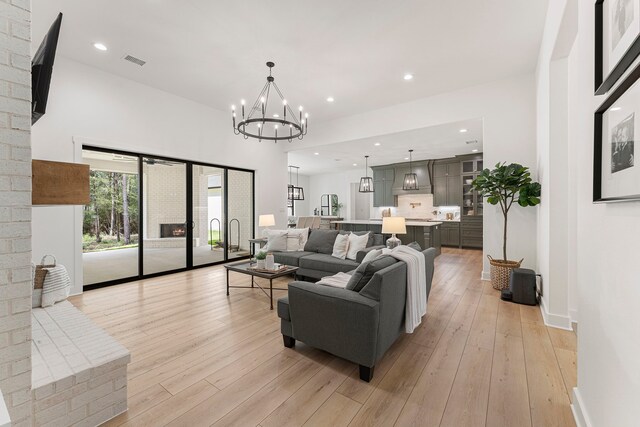 567 Lonestar Rd, Huntsville, TX 77340 - living area with light wood-type flooring, a chandelier, recessed lighting, and baseboards