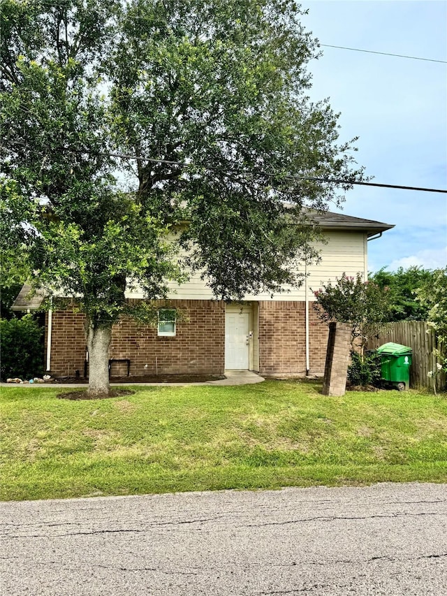 4631 Mi Castillo Ct, Houston, TX 77045 - view of property hidden behind natural elements featuring brick siding