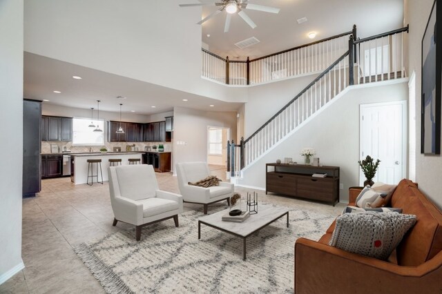 6763 Indian Ldg, San Antonio, TX 78253 - living room featuring a towering ceiling, a ceiling fan, stairway, light tile patterned floors, and recessed lighting