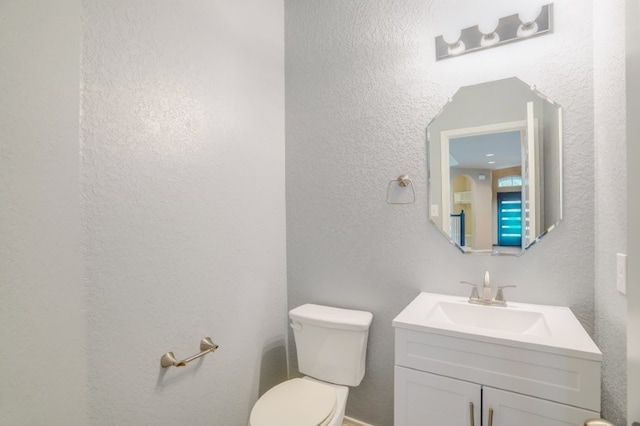 6763 Indian Ldg, San Antonio, TX 78253 - bathroom with toilet, a textured wall, and vanity