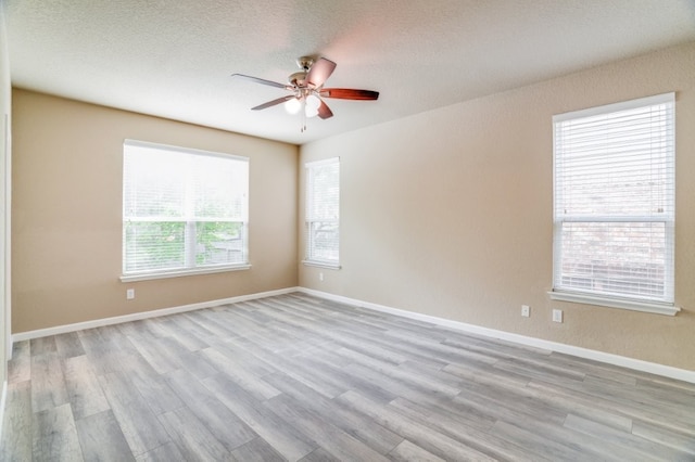 6763 Indian Ldg, San Antonio, TX 78253 - unfurnished room featuring ceiling fan, wood finished floors, a textured ceiling, and baseboards