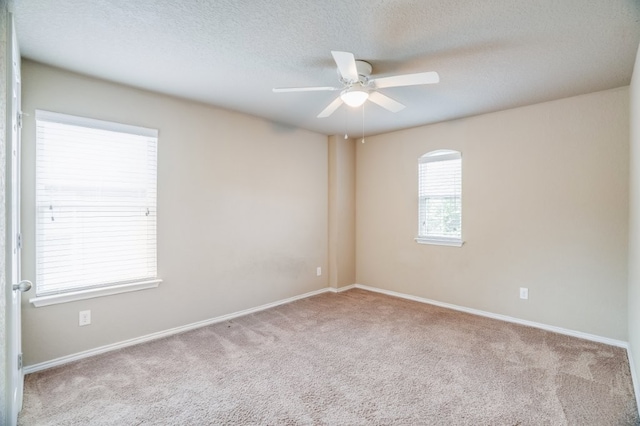 6763 Indian Ldg, San Antonio, TX 78253 - carpeted empty room with a ceiling fan, baseboards, and a textured ceiling