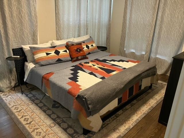 204 E Dry St, San Saba, TX 76877 - bedroom with wood finished floors