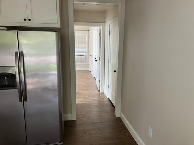 204 E Dry St, San Saba, TX 76877 - corridor with dark wood-style flooring and baseboards
