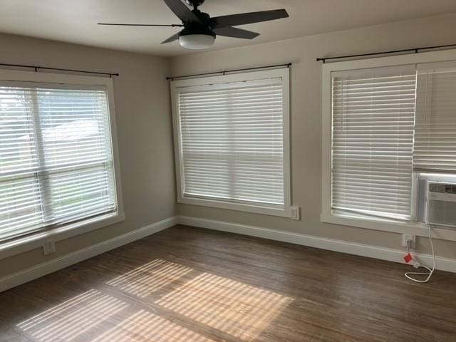 204 E Dry St, San Saba, TX 76877 - unfurnished living room with baseboards, wood finished floors, and a ceiling fan