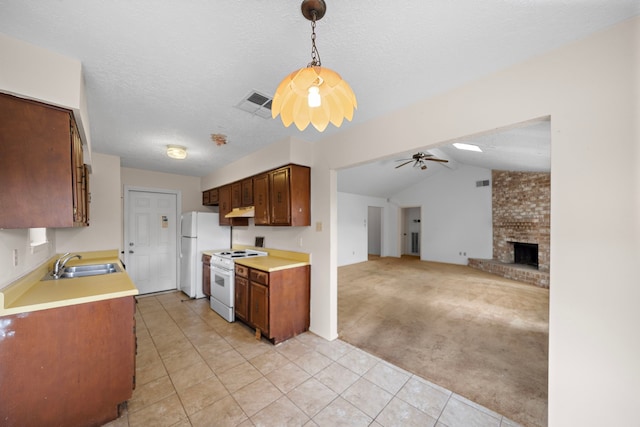 1639 Castle Creek Dr, Missouri City, TX 77489 - kitchen featuring white appliances, a sink, under cabinet range hood, light tile patterned floors, and a ceiling fan