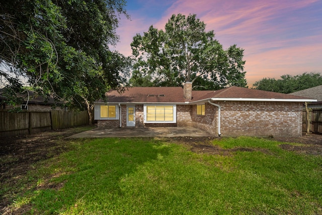1639 Castle Creek Dr, Missouri City, TX 77489 - rear view of property featuring a patio, brick siding, and a chimney