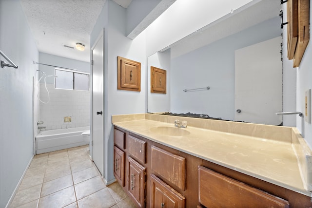 1639 Castle Creek Dr, Missouri City, TX 77489 - bathroom featuring vanity, toilet, tile patterned floors, washtub / shower combination, and baseboards