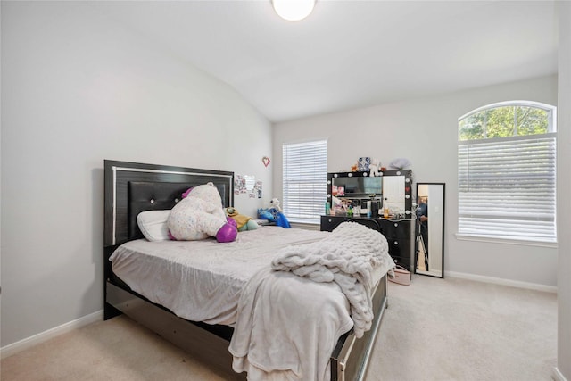 10123 Twila Springs Ct, Houston, TX 77095 - bedroom featuring light colored carpet, lofted ceiling, and baseboards