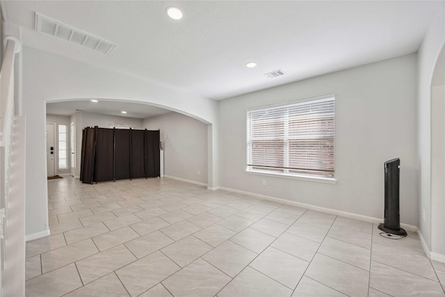 10123 Twila Springs Ct, Houston, TX 77095 - unfurnished room with recessed lighting, arched walkways, light tile patterned floors, and baseboards