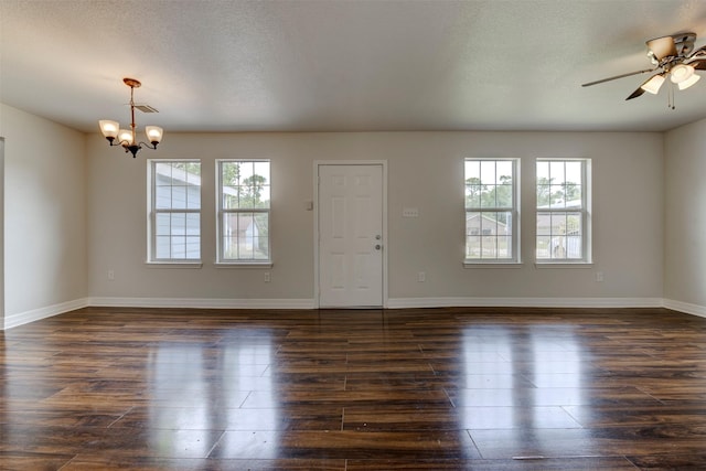 9022 Sultan Dr, Houston, TX 77078 - unfurnished room featuring a chandelier, dark wood-style floors, a ceiling fan, baseboards, and a textured ceiling