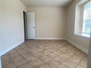 2214 S Ferrisburg Ct, Sugar Land, TX 77478 - spare room with baseboards