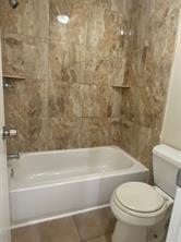 2214 S Ferrisburg Ct, Sugar Land, TX 77478 - full bathroom featuring toilet and tub / shower combination