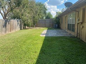 2214 S Ferrisburg Ct, Sugar Land, TX 77478 - view of yard featuring a patio area