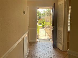 2214 S Ferrisburg Ct, Sugar Land, TX 77478 - doorway featuring light tile patterned flooring