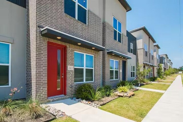 442 William D Fitch, College Station, TX 77845 - property entrance with brick siding, stucco siding, and a residential view