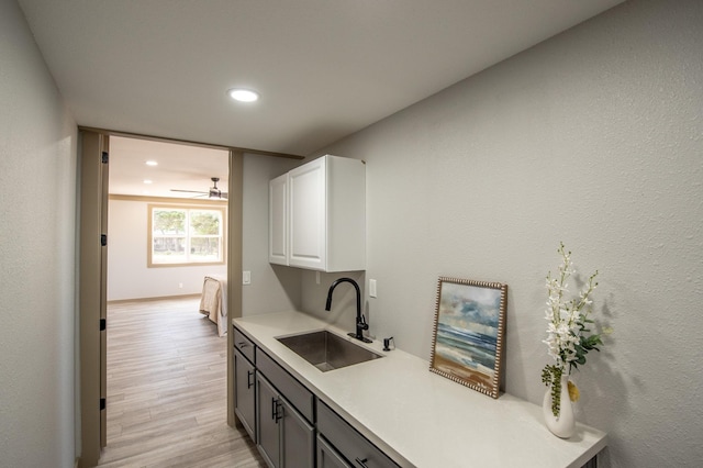 103 Whispering Oaks, Somerville, TX 77879 - kitchen with a sink, light countertops, recessed lighting, white cabinetry, and a ceiling fan