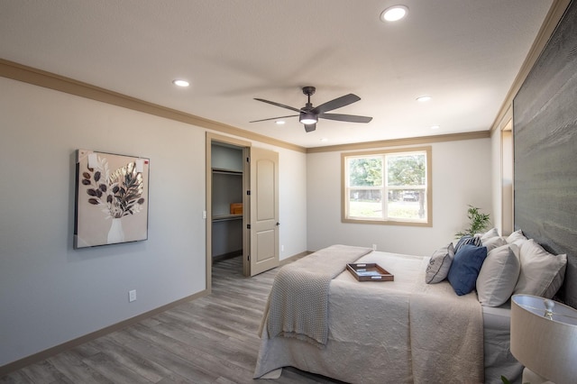 103 Whispering Oaks, Somerville, TX 77879 - bedroom featuring recessed lighting, wood finished floors, baseboards, ceiling fan, and ornamental molding