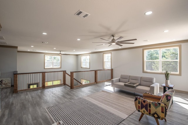 103 Whispering Oaks, Somerville, TX 77879 - living room with recessed lighting, a ceiling fan, ornamental molding, wood finished floors, and baseboards