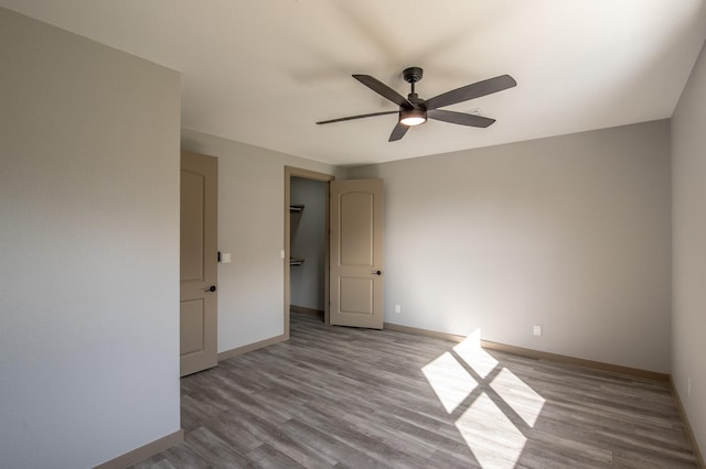 103 Whispering Oaks, Somerville, TX 77879 - spare room featuring a ceiling fan, baseboards, and wood finished floors