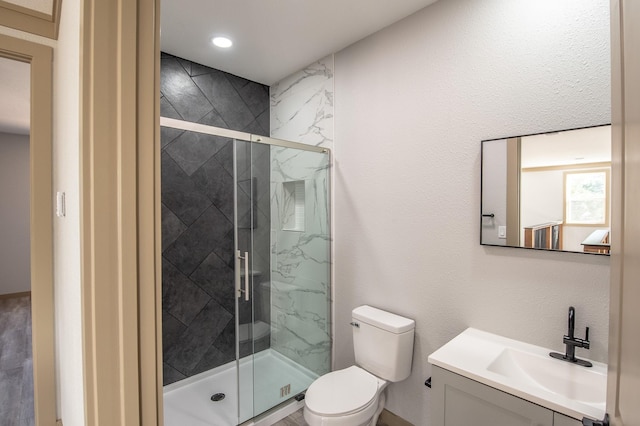 103 Whispering Oaks, Somerville, TX 77879 - full bathroom featuring vanity, toilet, and a marble finish shower