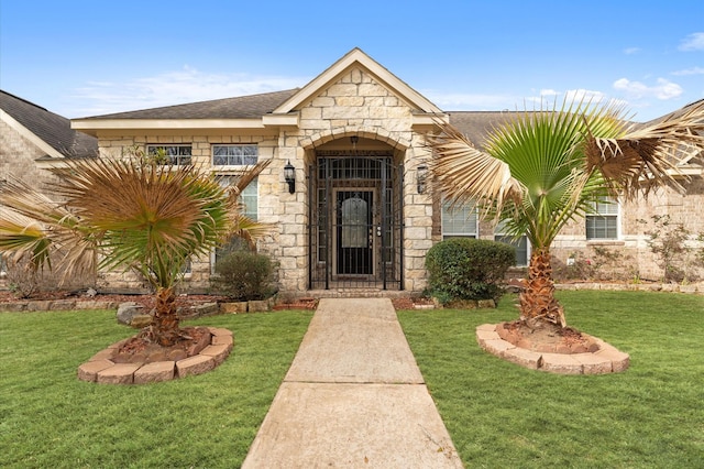 3303 Hickory Knoll Dr, Pearland, TX 77581 - doorway to property with stone siding and a yard