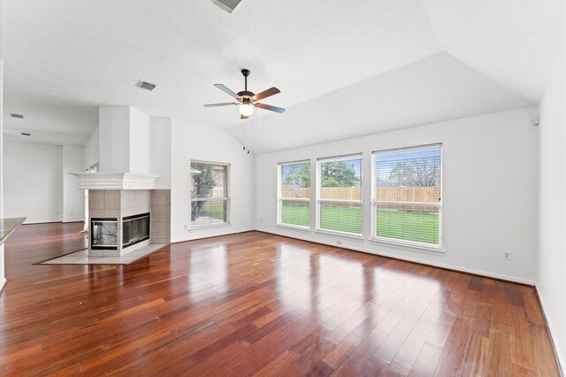 3303 Hickory Knoll Dr, Pearland, TX 77581 - unfurnished living room with lofted ceiling, a ceiling fan, a fireplace, and wood finished floors