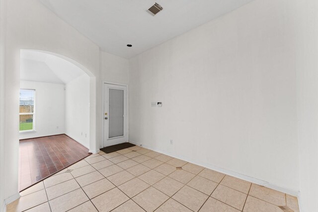 3303 Hickory Knoll Dr, Pearland, TX 77581 - spare room with arched walkways and light tile patterned floors