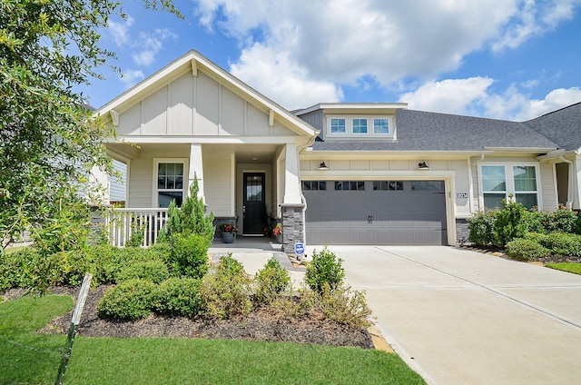 18234 Shoreline Vista Ln, Cypress, TX 77433 - craftsman-style home with an attached garage, board and batten siding, concrete driveway, a shingled roof, and stone siding