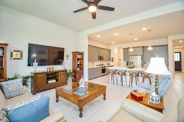 18234 Shoreline Vista Ln, Cypress, TX 77433 - living area with ceiling fan, light wood-style flooring, and recessed lighting
